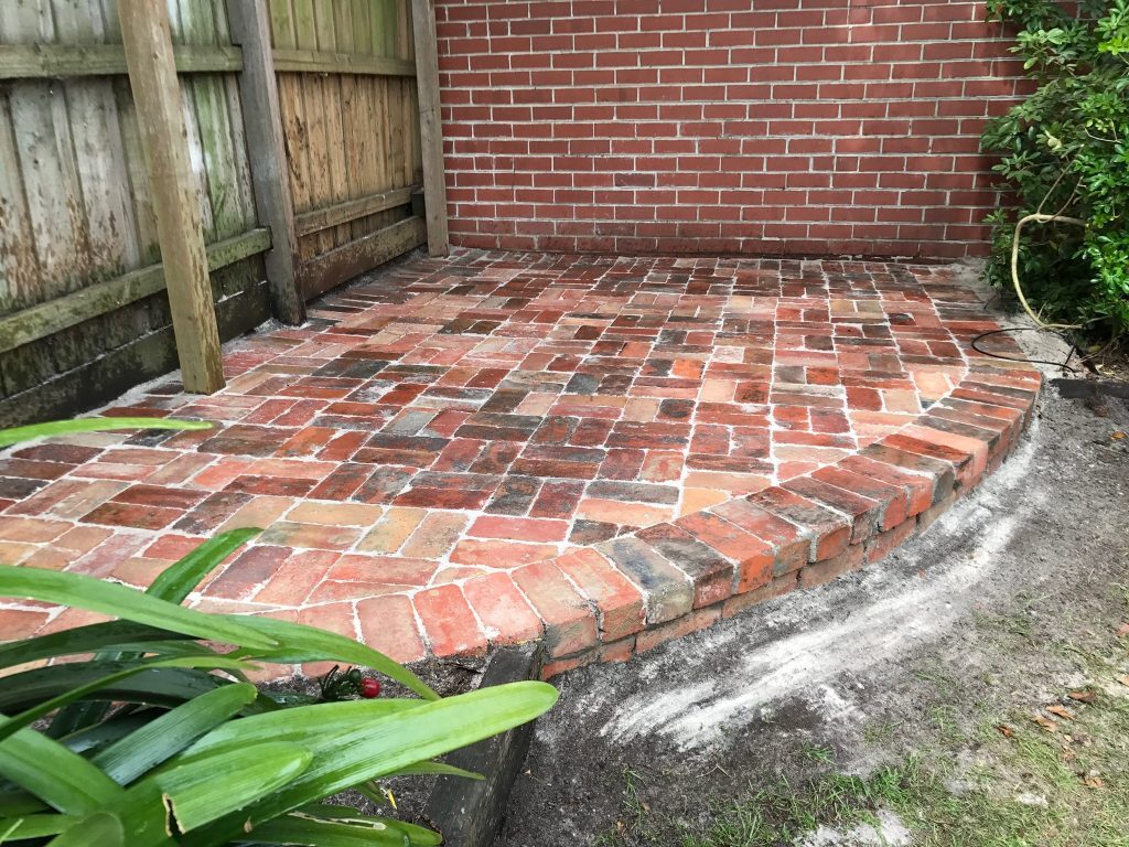 Completed paving project with intricate stonework