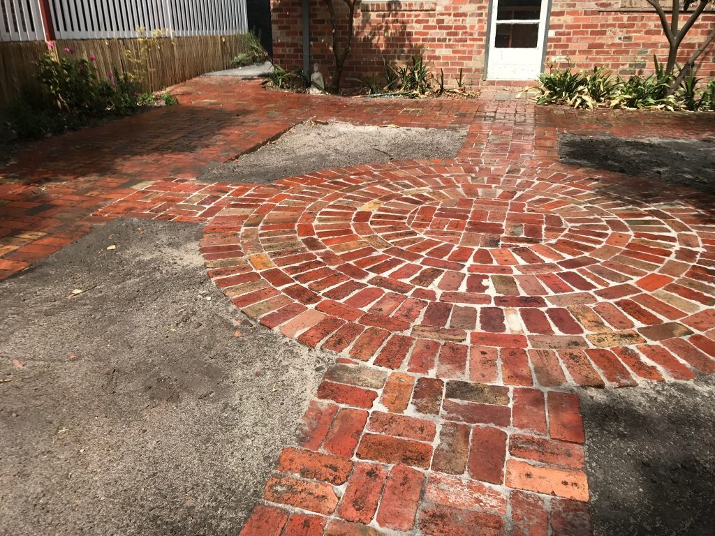 "Finished garden project with stone paving"