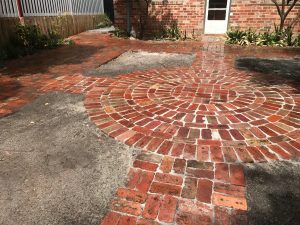 "Finished garden project with stone paving"